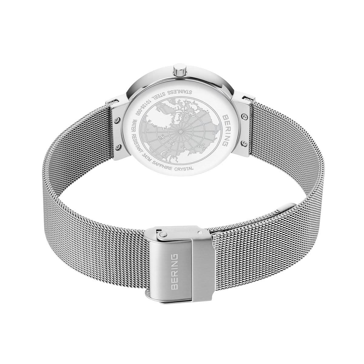 Damklocka med synlig boettbaksida, silverfärgat Milanese-armband och Bering-logotyp