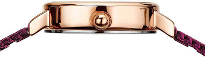 Damklocka sidodel i roséguld med rund lugg och fäste vid lila armband.