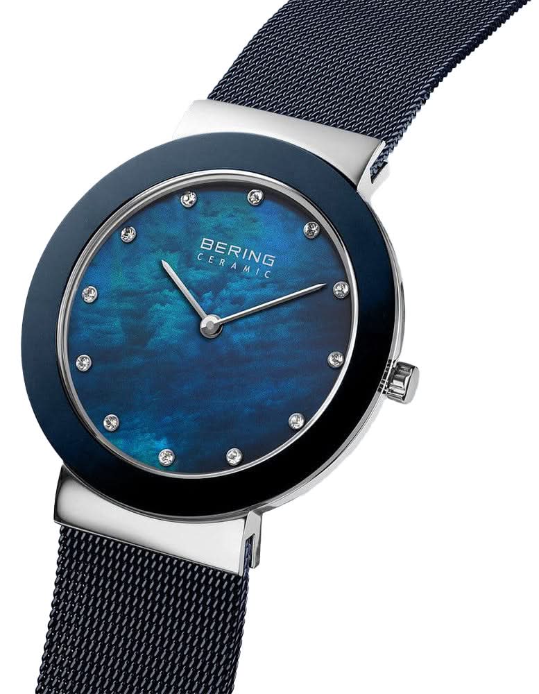 Bering damklocka, blå urtavla med index och mesh-armband, sidokrona