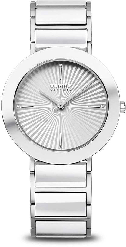 Bering damklocka med silverfärgat metallarmband, rund urtavla med strålmönster