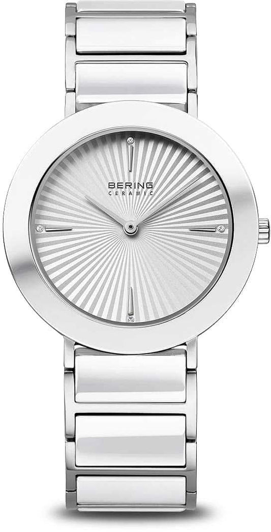Bering damklocka med silverfärgat metallarmband, rund urtavla med strålmönster