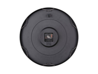 Baksida på väggklocka med fäste och batterifack i mörk cirkelform