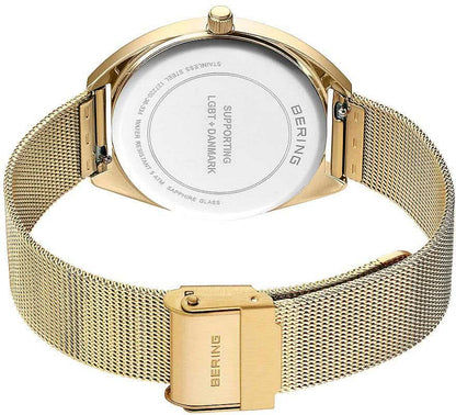 "Damklocka med silverfärgad urtavla och guldfärgat mesh-armband"