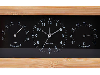 Rektangulär väckarklocka med träram, svart urtavla samt termometer och hygrometer