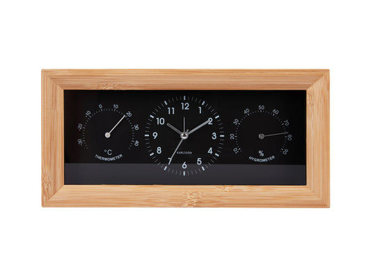 Rektangulär väggklocka med träram och svart urtavla, termometer och hygrometer
