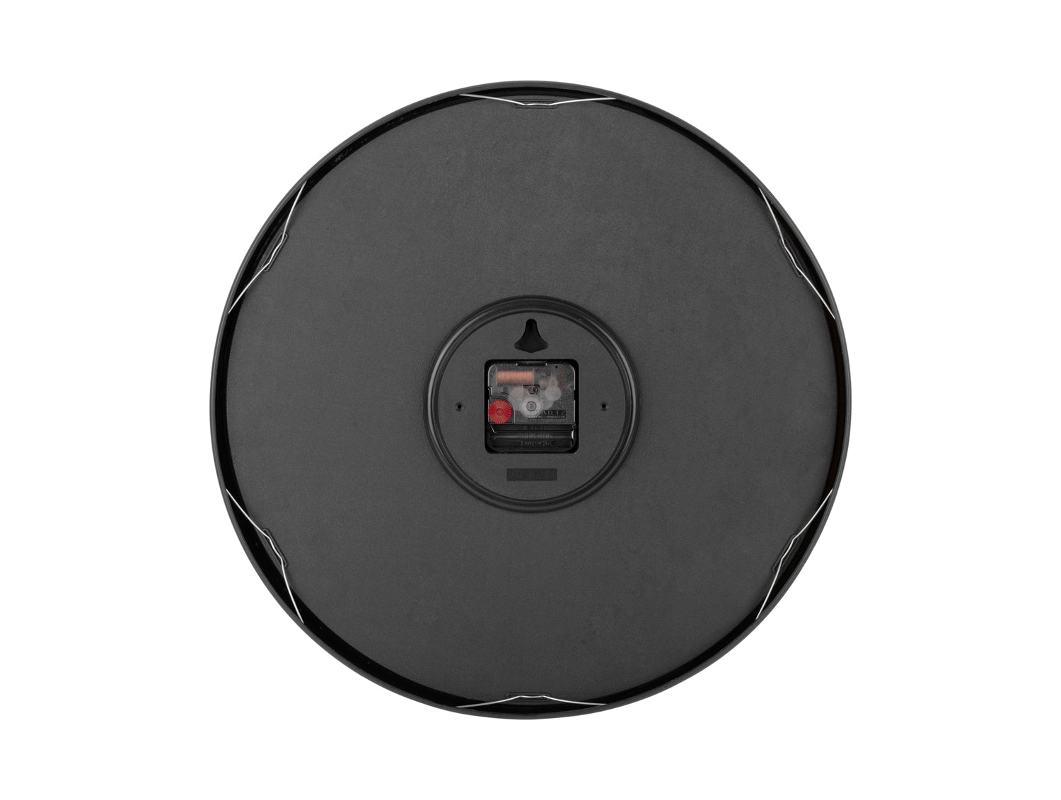 Baksida väggklocka: svart lock med batterifack i mitten