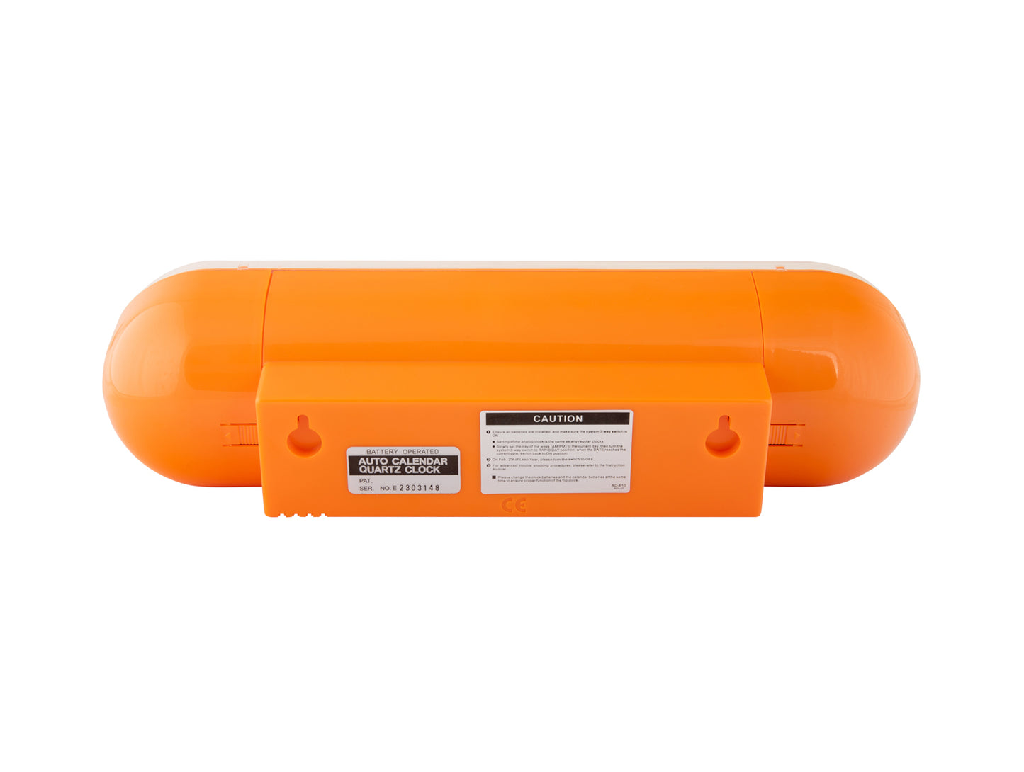 Orange väggklocka baksida med upphängning och typskylt