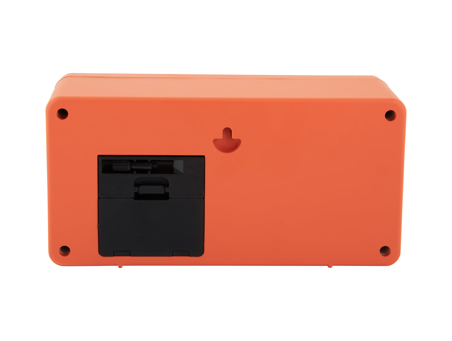 Baksida på en orange retro väggklocka med anslutningsfack