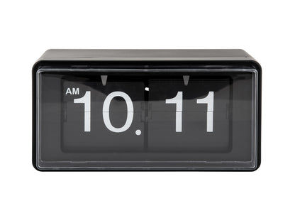 Retro väggklocka med svart ram, vikbara siffror i fönster, visning AM 10:11