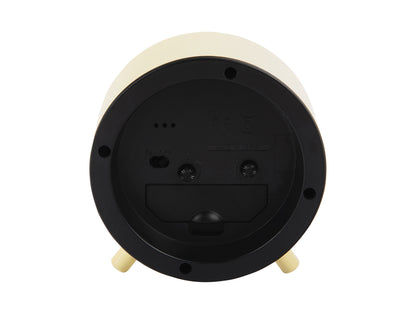 Gradient-väckarklockans undersida med batterifack och två fötter