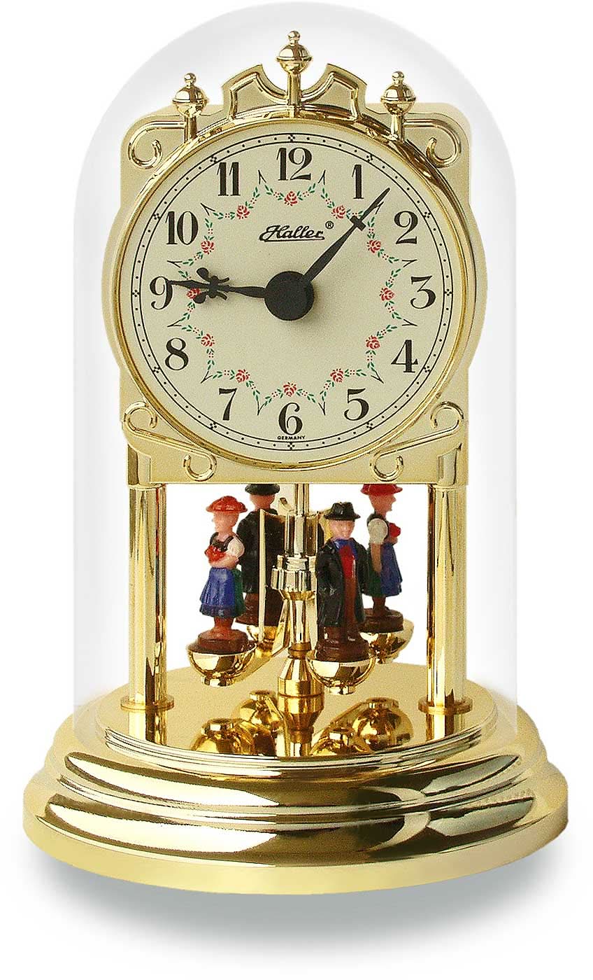 Mässingsbordsklocka med glaskupa, urtavla och rotationspendel; figurer undertill