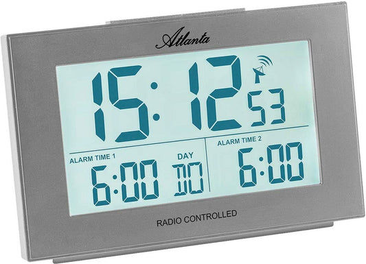 Digital radiostyrd väckarklocka med blå LCD-display, grått hölje och larmindikering