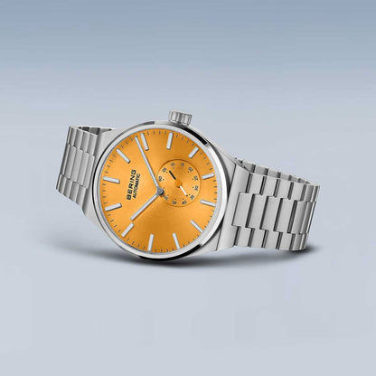 Herrklocka med orange urtavla och armband i silverfärgat rostfritt stål