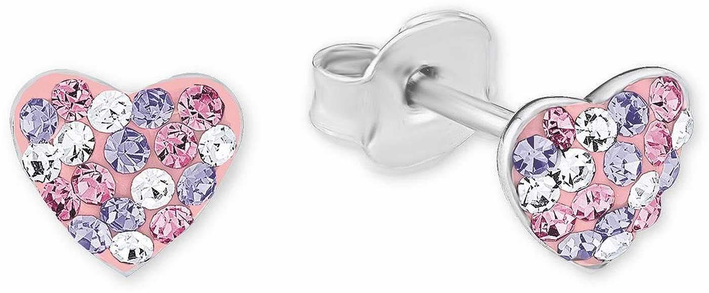 Hjärtformade örhängen i metall med rosa stenar, gnistrande mönster.