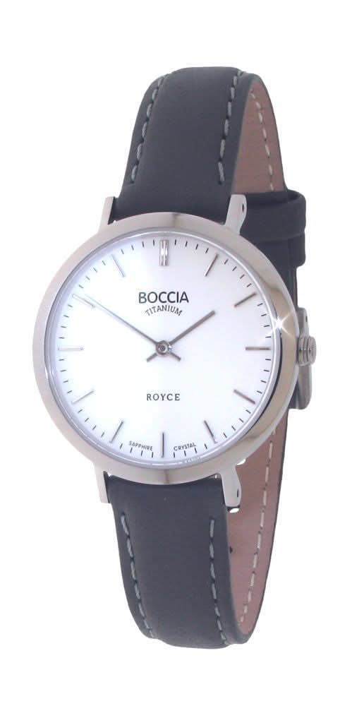 Damklocka med rund vit urtavla, silverfärgad boett och mörkblått läderarmband.