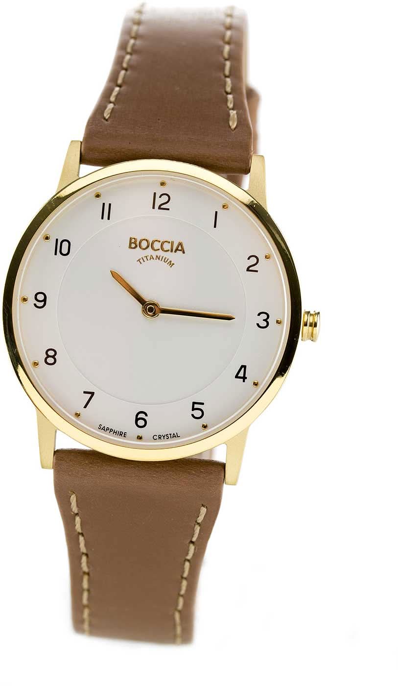 Boccia damklocka med brunt läderband, runt guldfärgat boett och vit urtavla