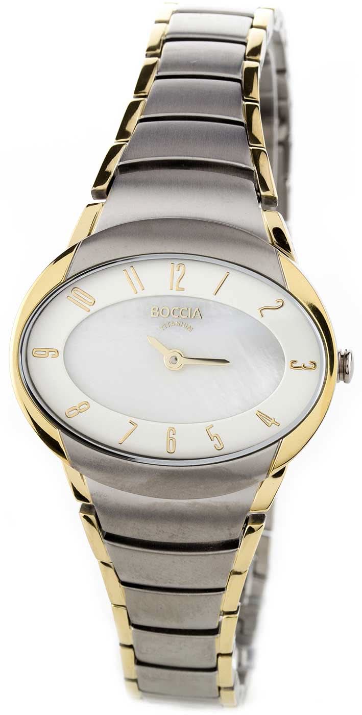 "Damklocka med vit urtavla, guldfärgade accenter och grått metallarmband"