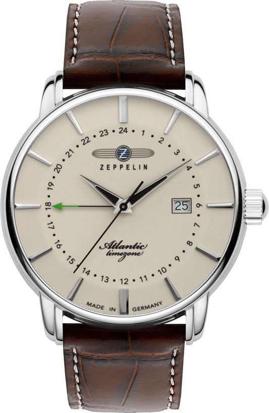 Herrklocka med silverfärgat hölje, beige urtavla och brunt läderarmband, analog visning