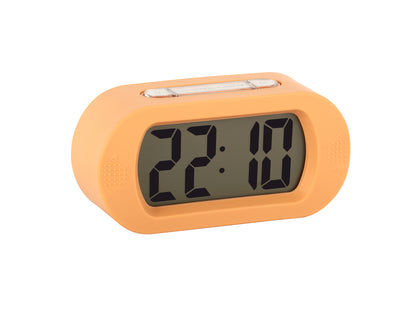 Digital väckarklocka i mjukorange, framsida med stor LCD-display och tid