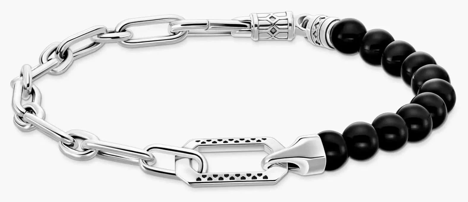 Armband med silverfärgade länkar och svarta onyxpärlor, med lås