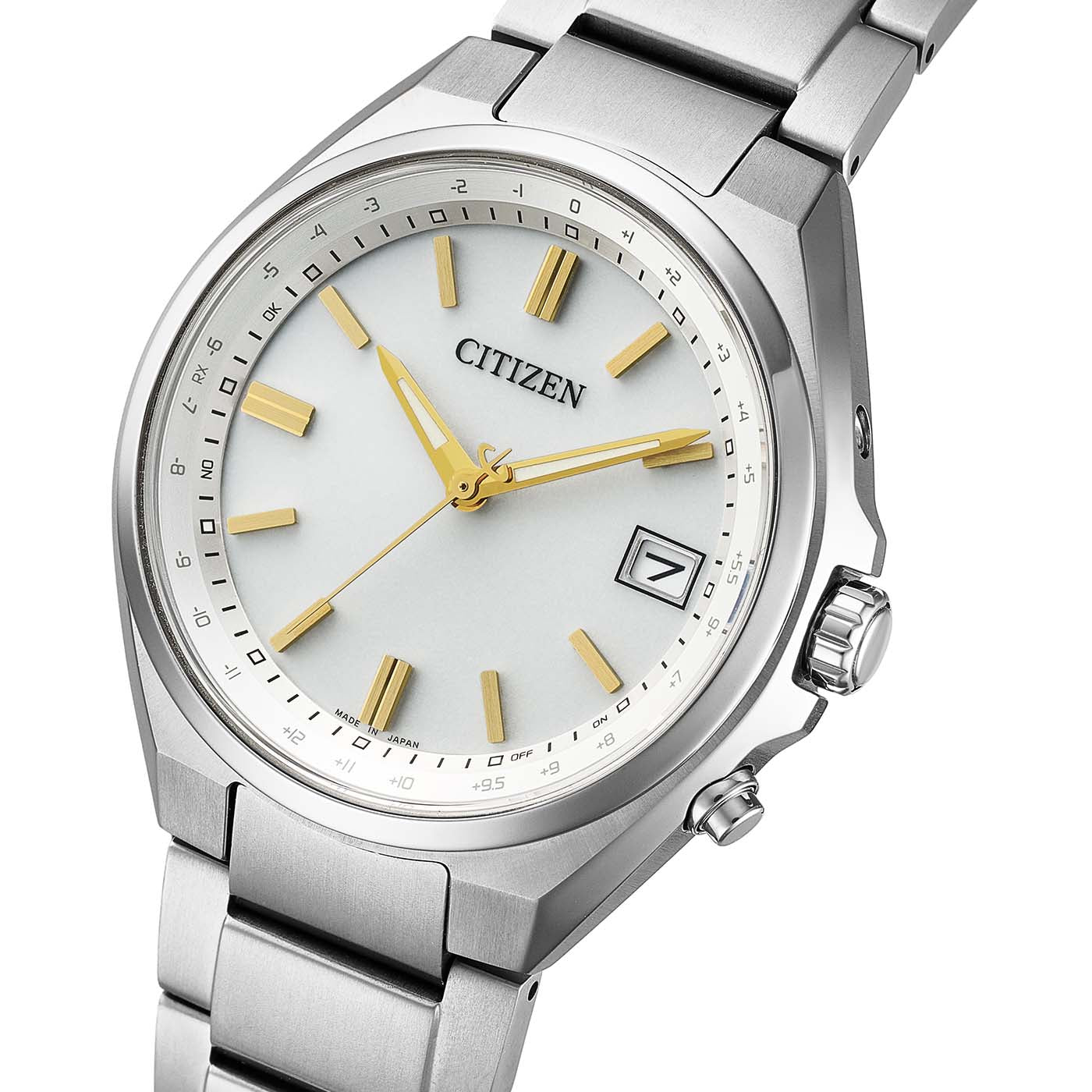 Armbanduhr mit elfenbeigfarbenem Zifferblatt, goldfarbenen Indexen und Zeigern