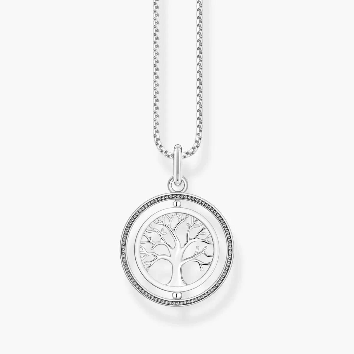 Runt medaljong i silver med träd-motiv och infattning av zirkoniastenar
