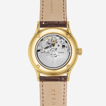 Herrklocka, öppet visningsfönster med urverk; beige läderarmband