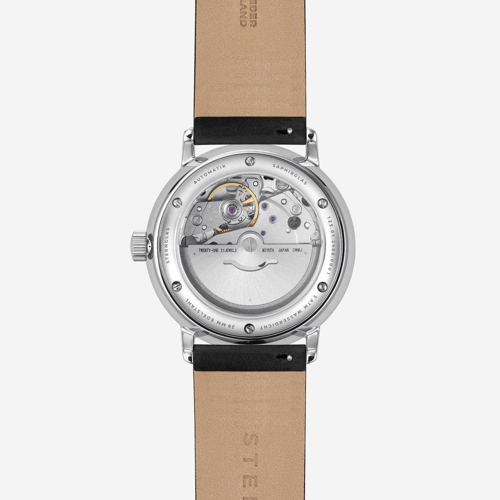 Herrklocka med öppen boett och synligt urverk, beige läderarmband.