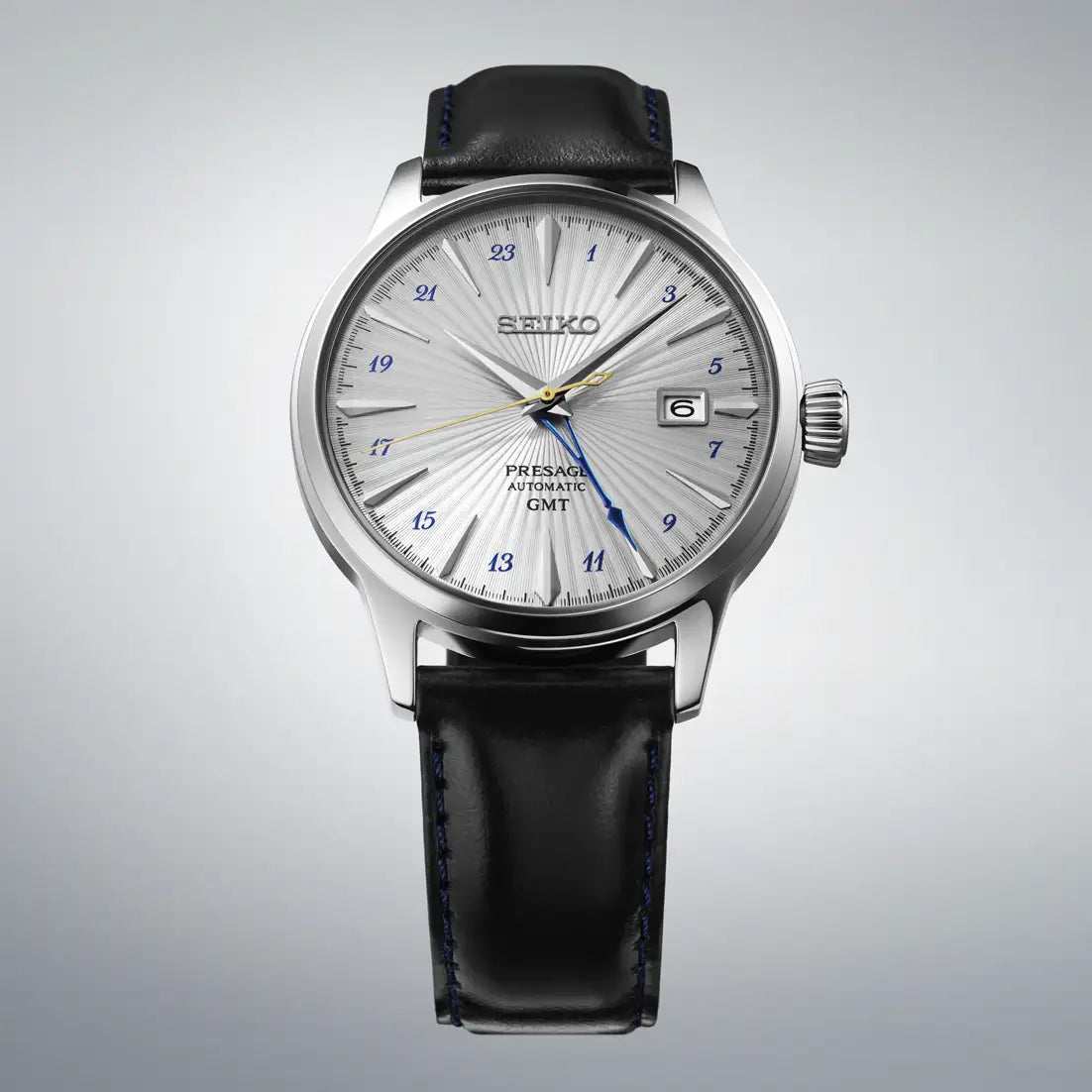 Seiko herrklocka, rund silverfärgad urtavla med datumfönster och svart läderarmband