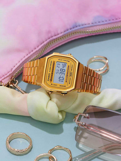 Guldtonad Casio-klocka med metallarmband och digital display, vy över urtavlan