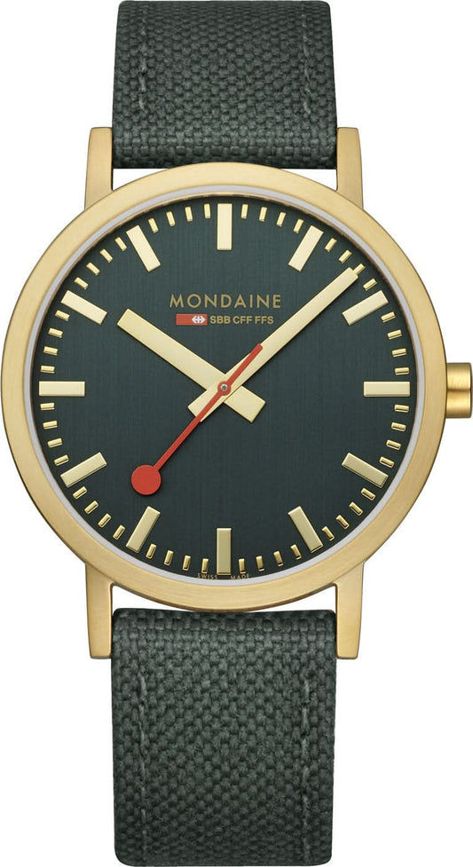 Unisex-armbandsur med mörkgrön urtavla, guldfärgade visare och grått tygband.