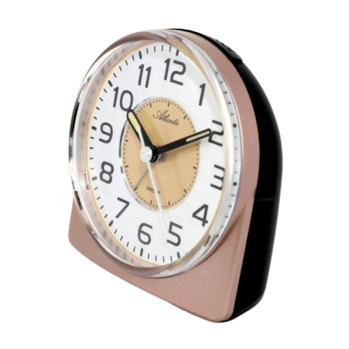 Väckarklocka med runt glas och beige urtavla, sned frontvy