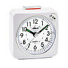 Väckarklocka med vit boett, urtavla med gröna visare och numrerade timmar