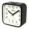Liten svart analog väckarklocka med vit urtavla och siffror 1 till 12