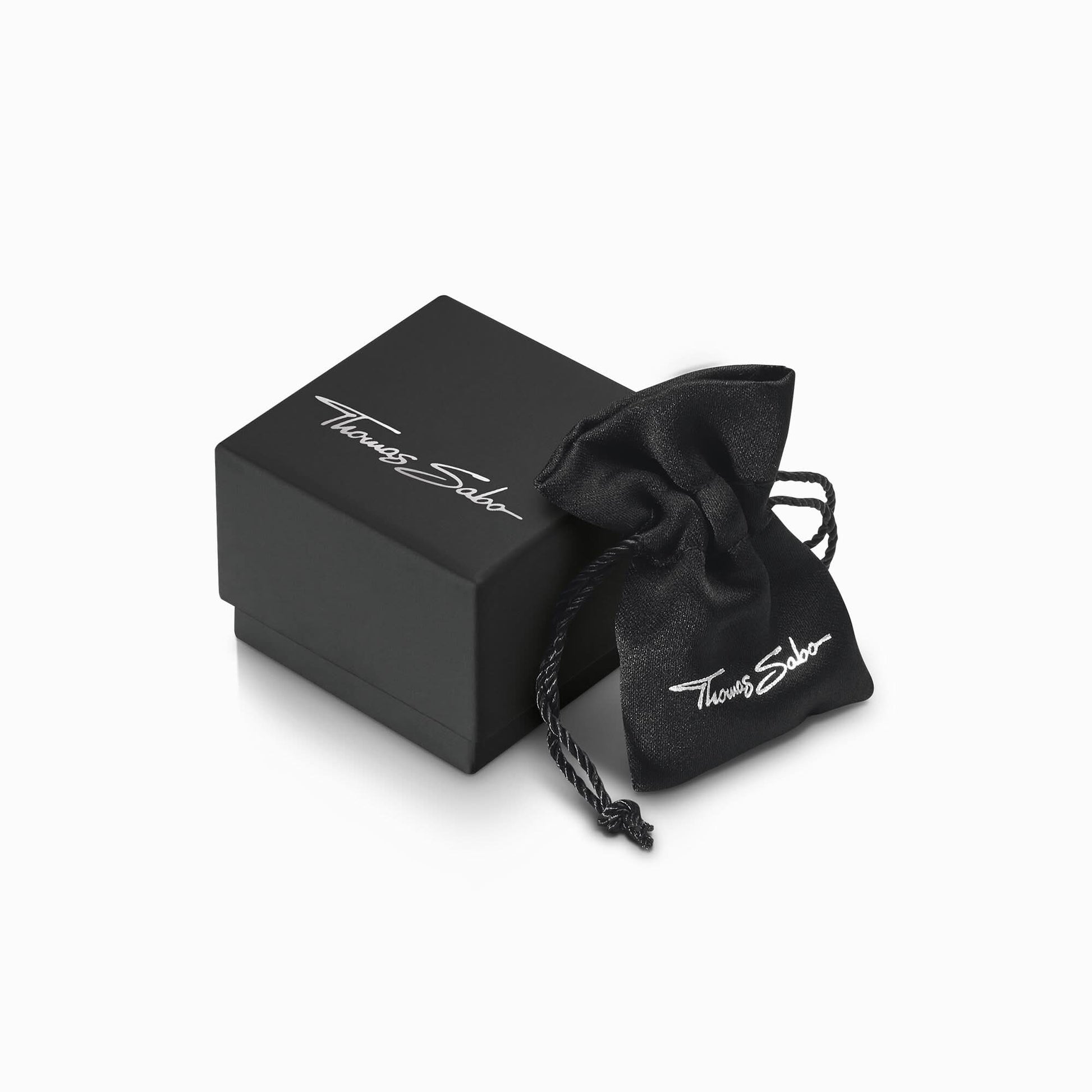 Smyckeskrin och svart påse med Thomas Sabo-logotyp