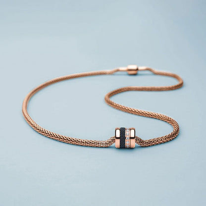 Armband med roséguldpläterad berlock och blått flätat band
