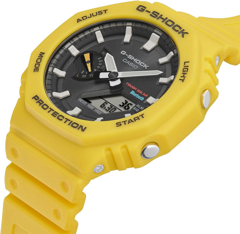 Casio G-Shock herrklocka med gult hölje, rund display och svarta knappar