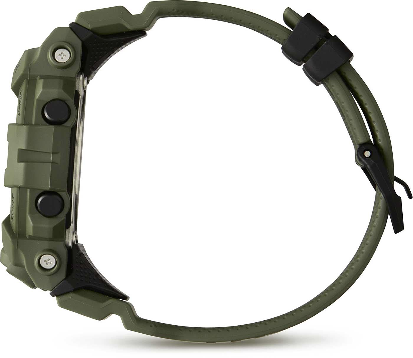 Digital herrklocka sedd från sidan med grönt boett och gummiband