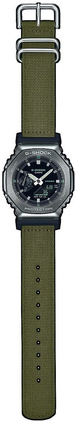 Casio G-Shock herrklocka med grönt textilarmband, mörkgrått hölje och svart urtavla.