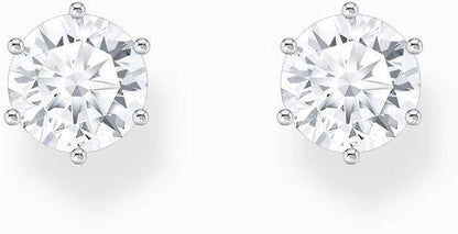 Silverfärgade örhängen med stor vit zirkonsten i gnistrande infattning