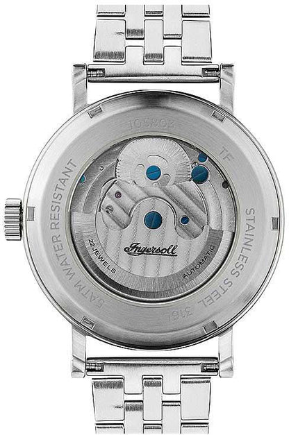 Baksida av herrklocka med glasboett, blå detalj och silverfärgat metallarmband