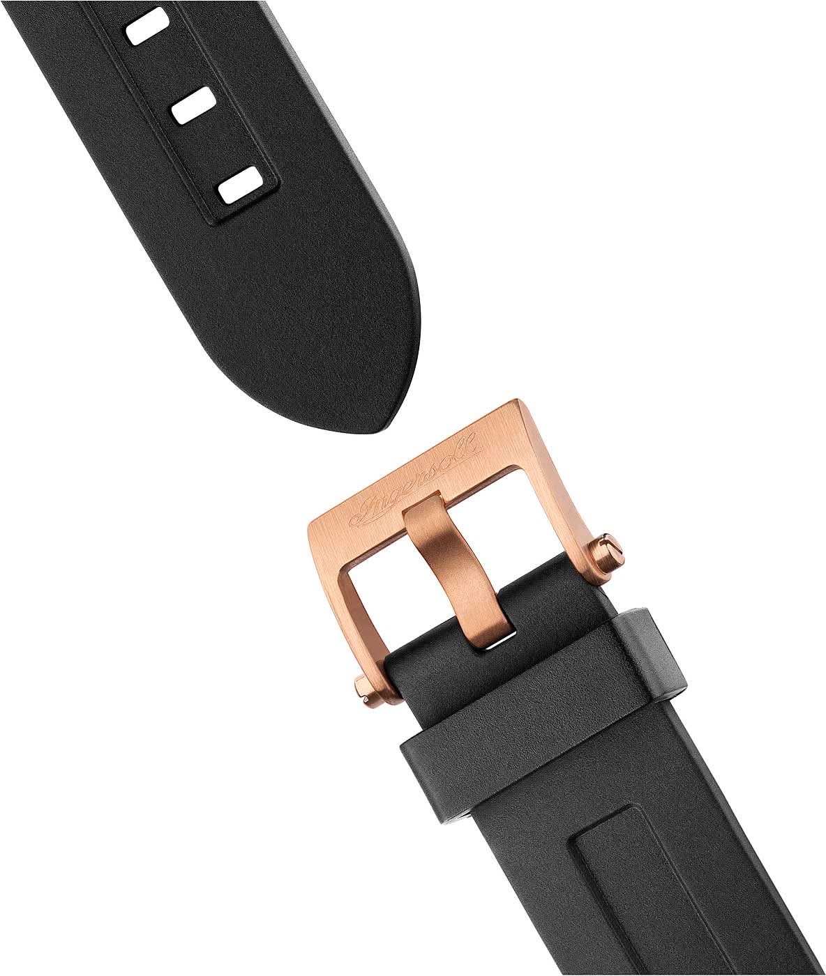 Herrklockans armband och spänne: svart gummiarmband med roséguldpläterat stiftspänne.