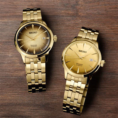 Två SEIKO herrarmbandsur med guldfärgade urtavlor och datumfönster vid 6