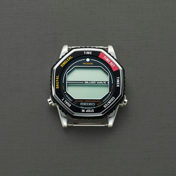 Seiko digital klocka: svart boett, metallarmband och ljusgrön display
