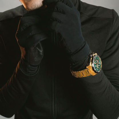 FESTINA kronografklocka på handleden med grön urtavla och guldfärgat armband