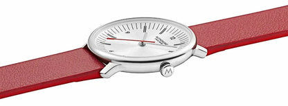 Damklocka med rött läderarmband, sidovy av den runda vita urtavlan.