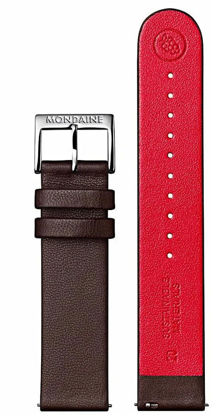 Herrklockarmband i detalj: brun baksida och röd utsida med präglingar