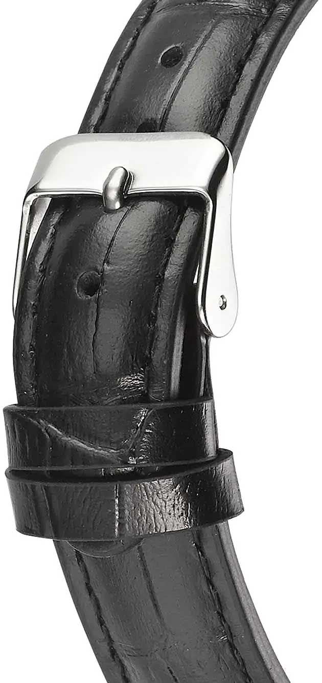 "Damklocka med svart läderarmband och metallfäste vid boettens undersida"
