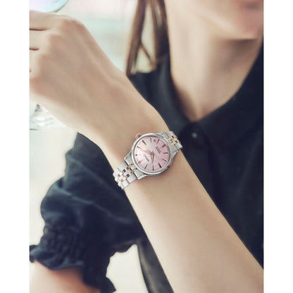Seiko Presage damklocka på handleden, silverfärgat/roséguldpläterat metallarmband med rosa urtavla