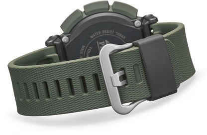 Herrklocka med dornspänne på mörkgrönt armband och grå boett.